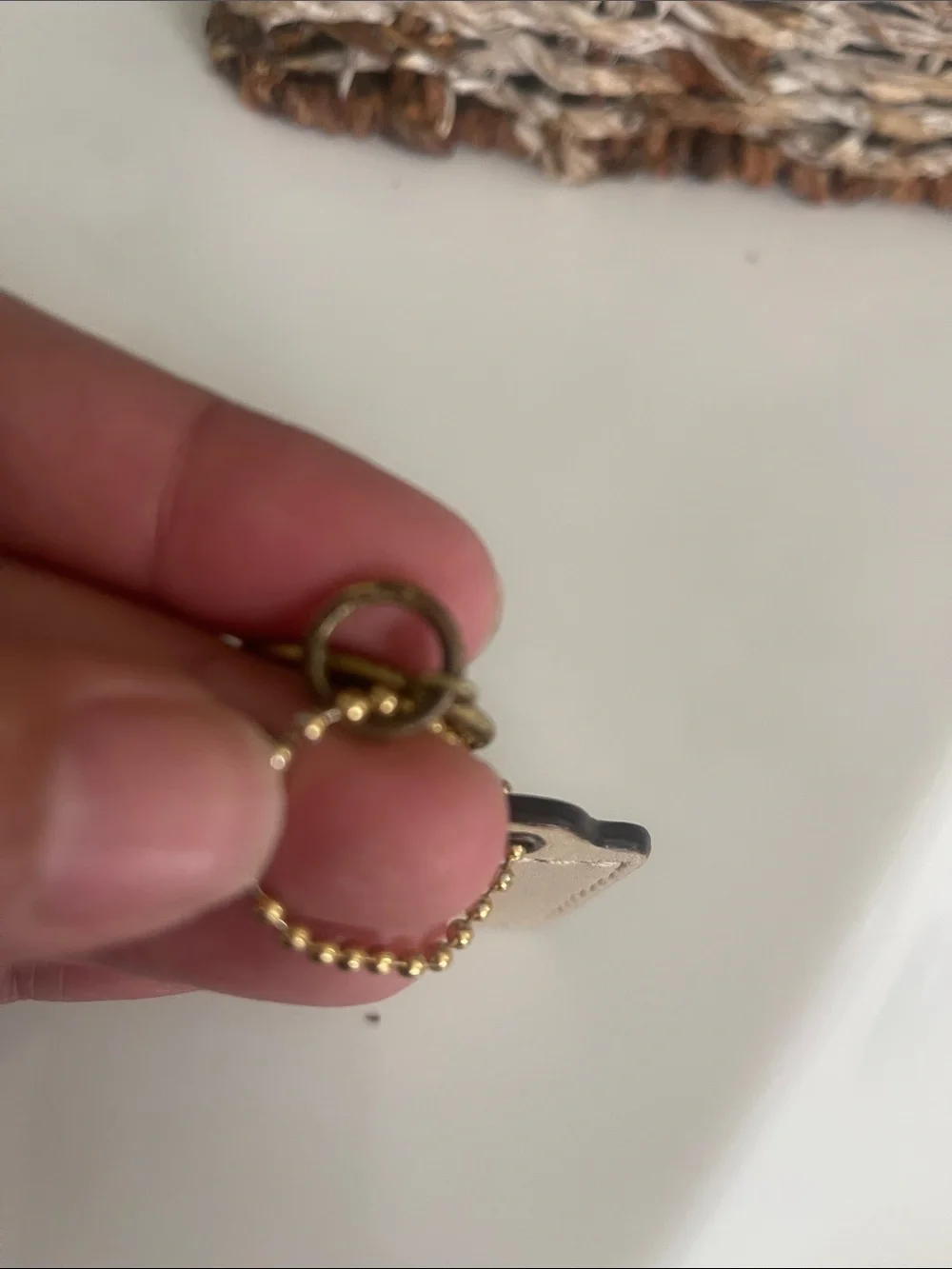 Coach Beige Leather Tag with Gold Medallion Charm  Some discoloration